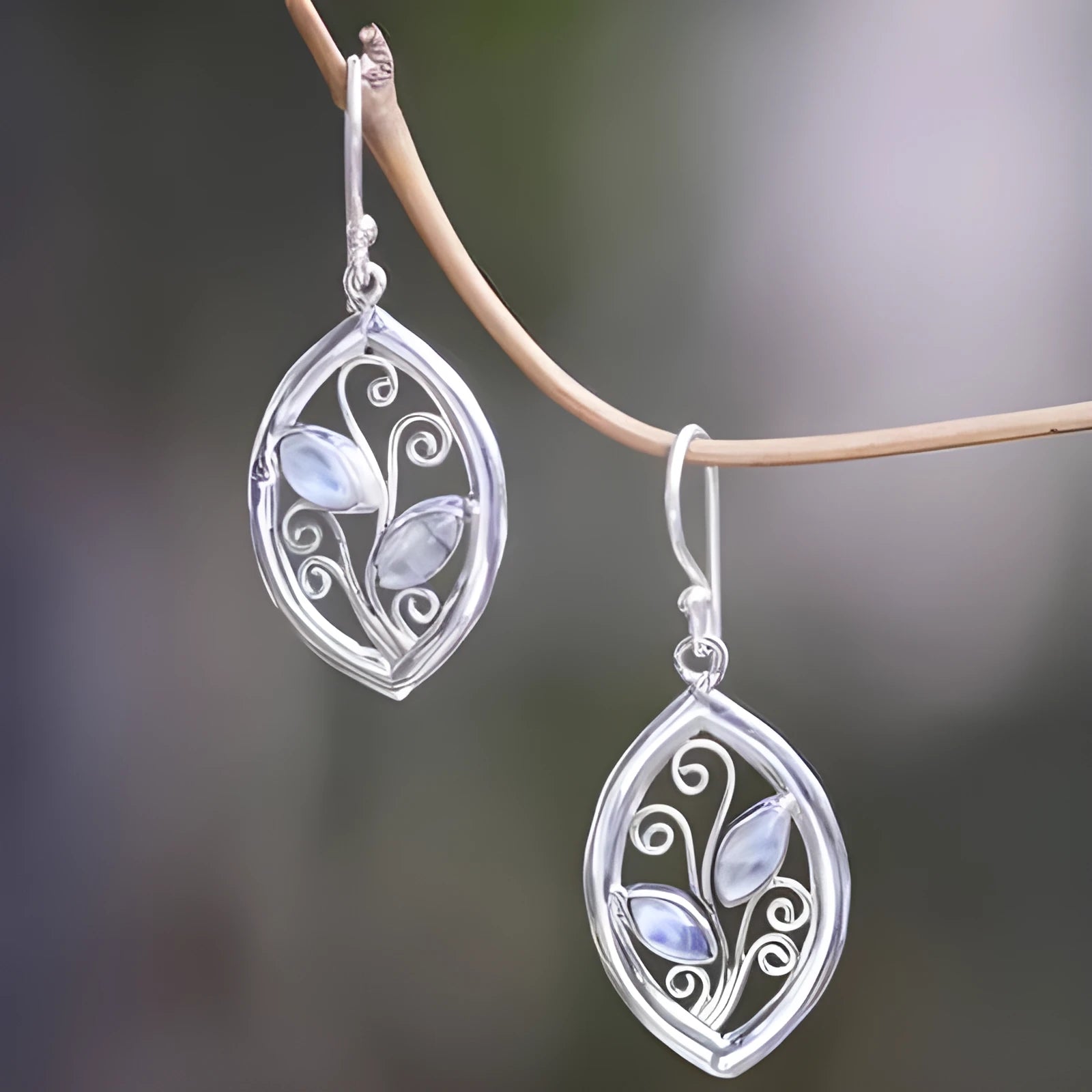 Silver colour women's earrings with creative leaves design embedding colourful moonstones