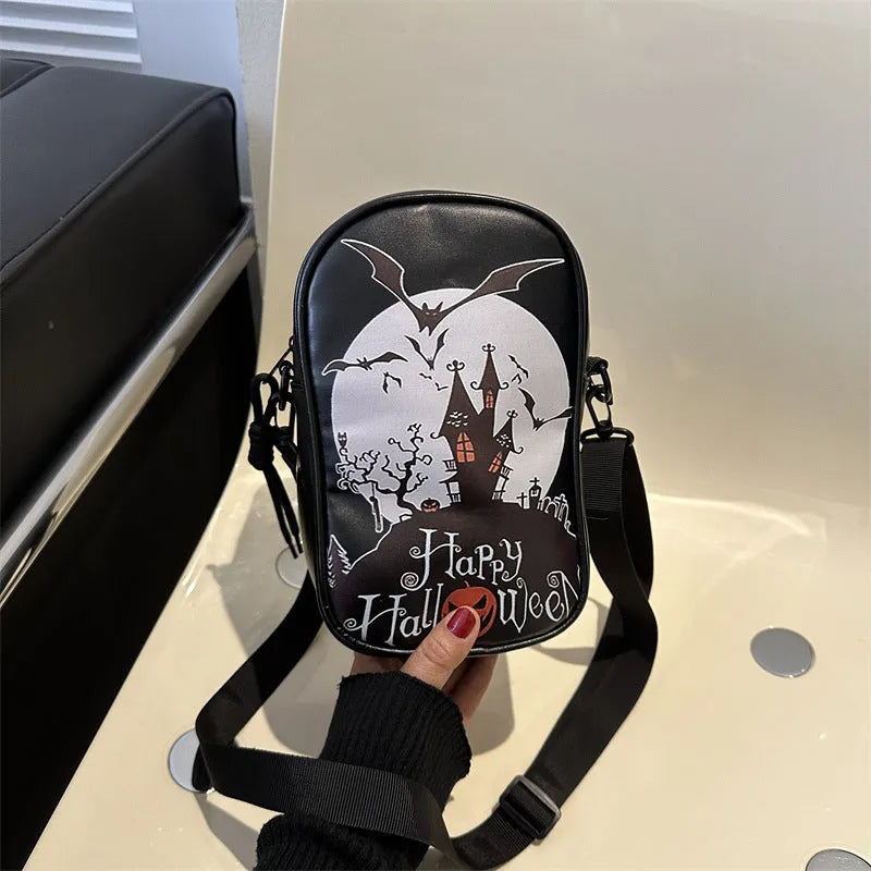 Halloween graffiti print crossbody bag with cartoon pumpkin ghost bat design in orange colour