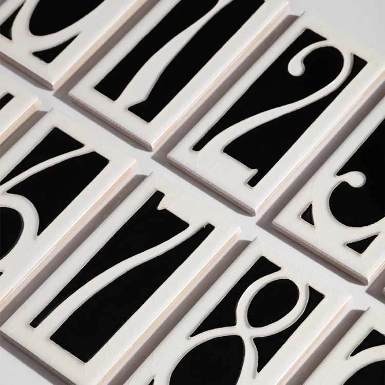 Handmade retro style enamel ceramic door plate showing a number, 76mm by 152mm.