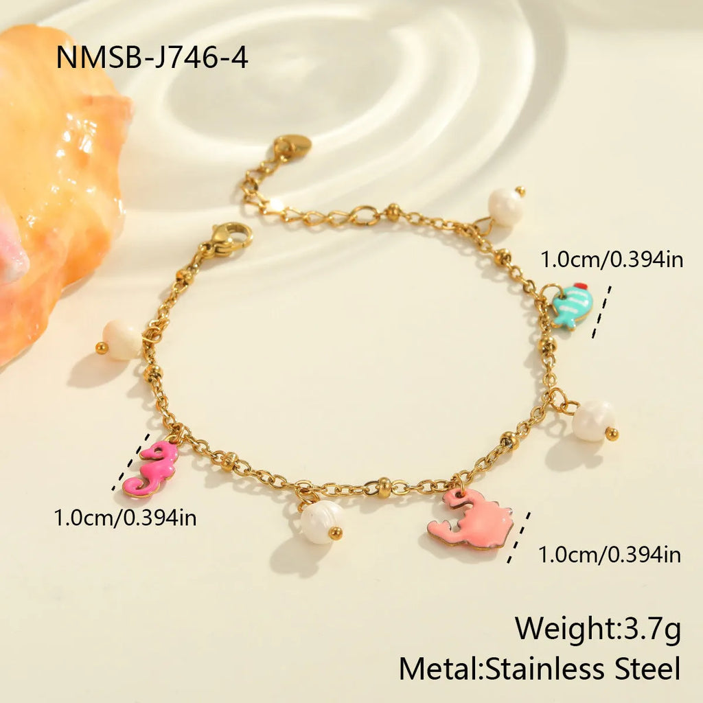 Stainless steel geometric pendant necklace with 18K electroplate and matching alloy bracelet on surface