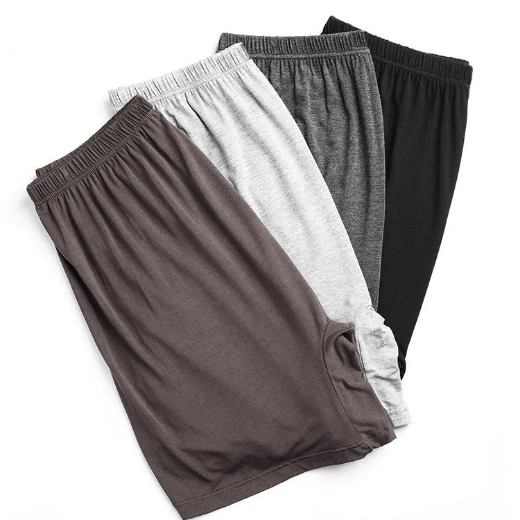 Men's solid colour modal boxers in black, blue, grey, and brown with high waist design