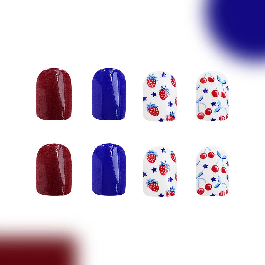 Short glossy red and blue nail stickers with strawberry and cherry pattern, pack of 24.