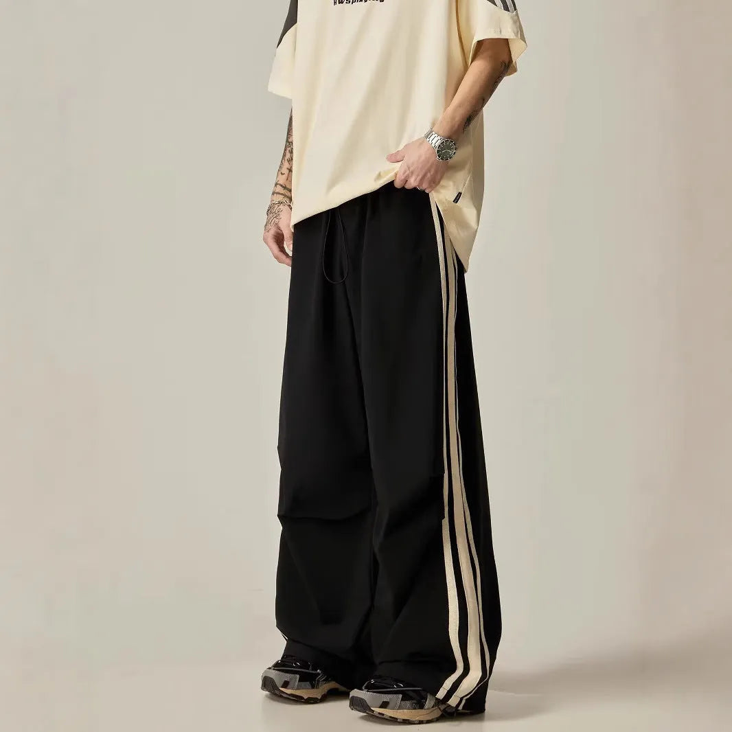 Black men's wide leg climbing trousers with high waist and straight leg design.