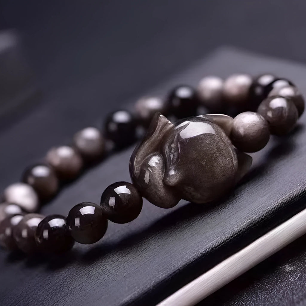 Obsidian bracelet with silver fox charm and 8mm polished bead