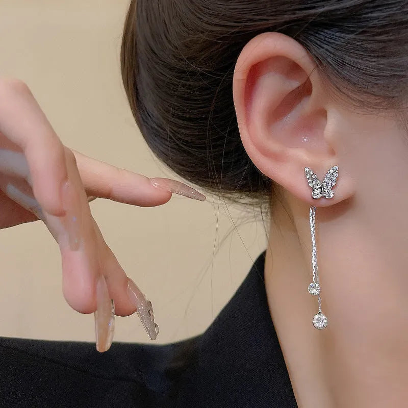 Silver alloy butterfly tassel earrings with geometric design, fresh style, on white background