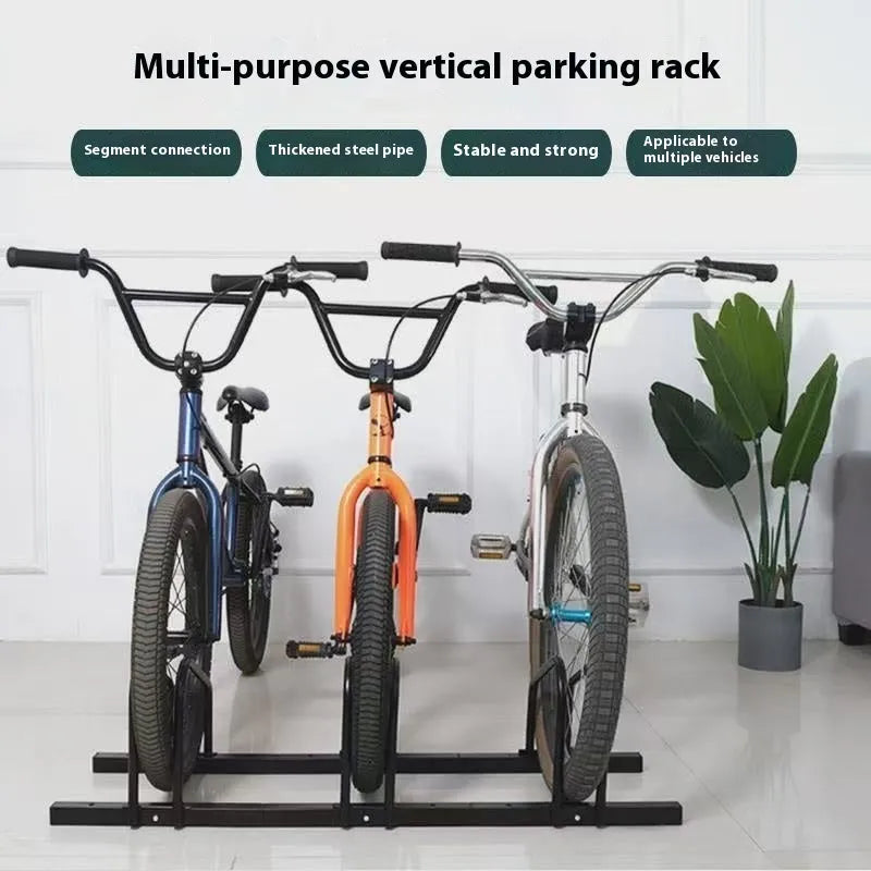 Black metal bicycle parking rack with four card positions holding bicycles upright