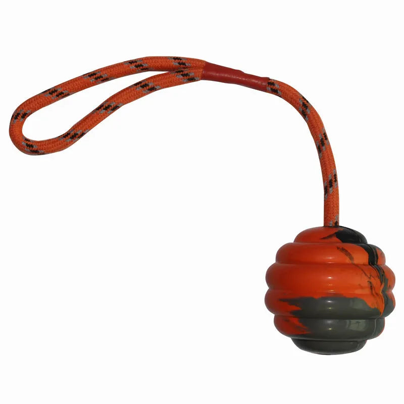 Rubber dog ball with rope knot in blue colour showing textured surface