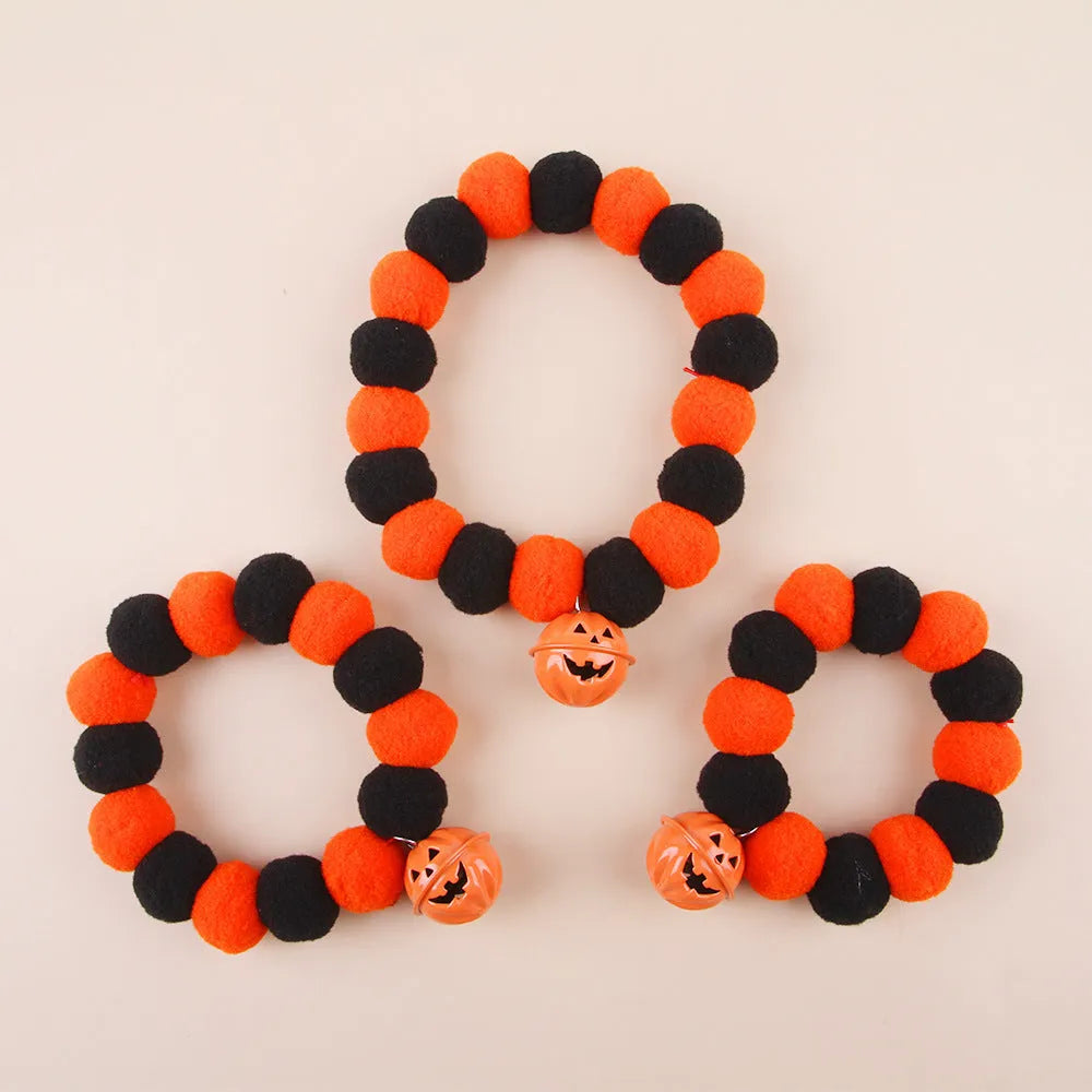 Orange Halloween pumpkin cat collar with adjustable buckle shown in small, medium, and large sizes