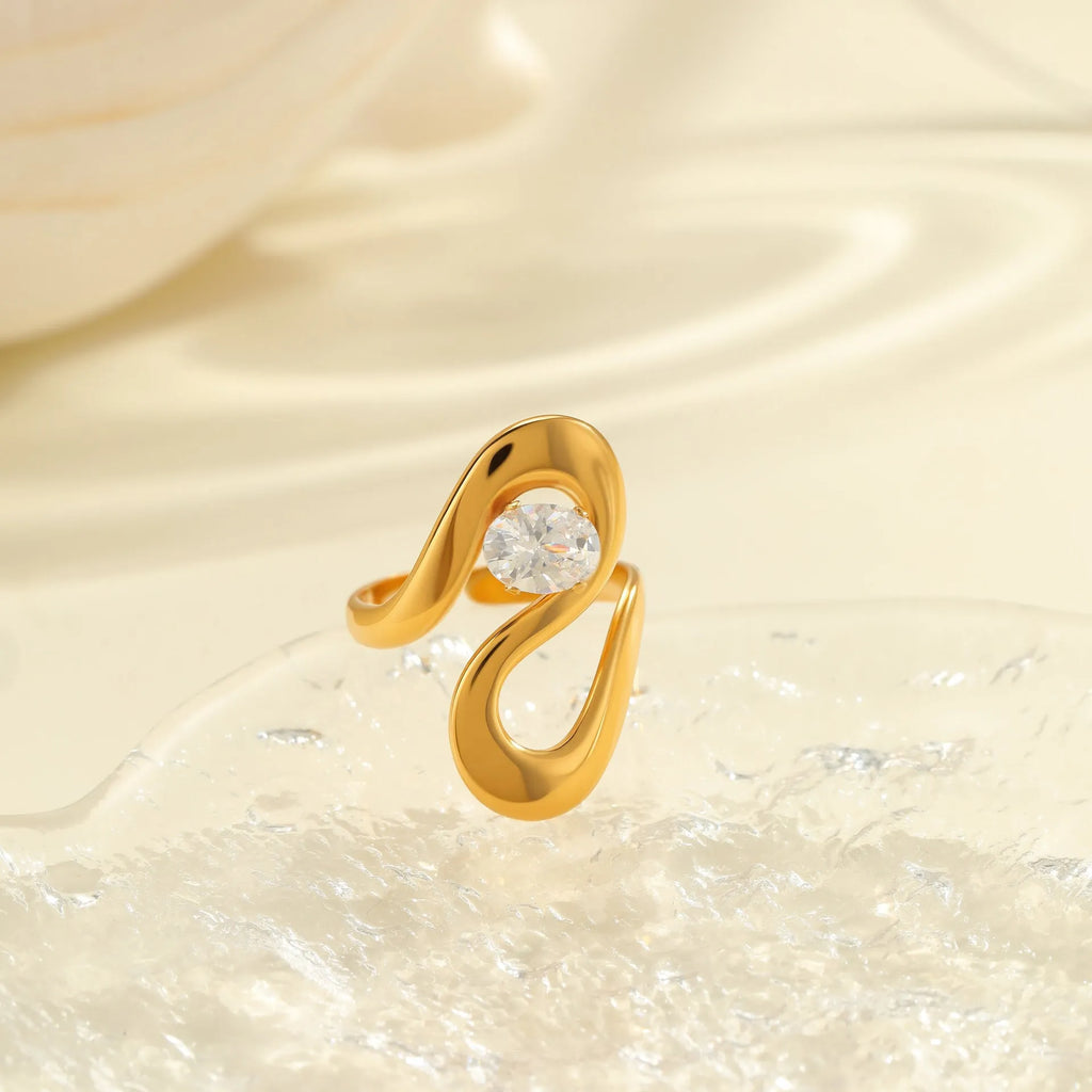Women's stainless steel geometric zircon ring with open mouth design on a hand.