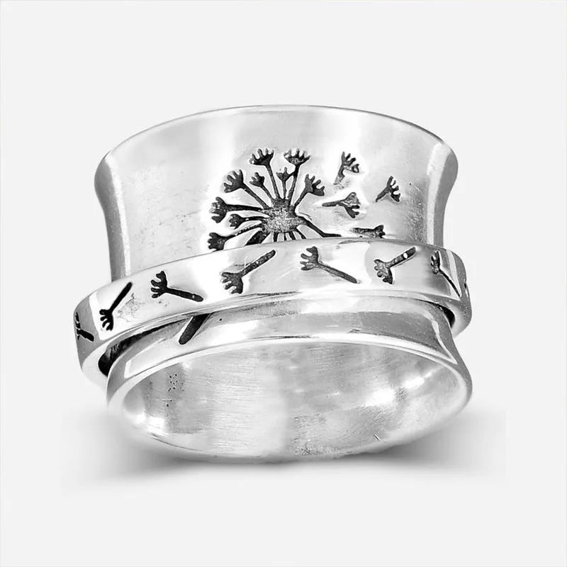 Silver-colour rotating flower ring showing floral element that moves independently of band