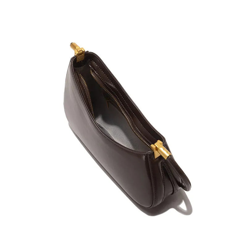 Women's oval-shaped PU leather underarm handbag in multiple colours with sandwich pocket design