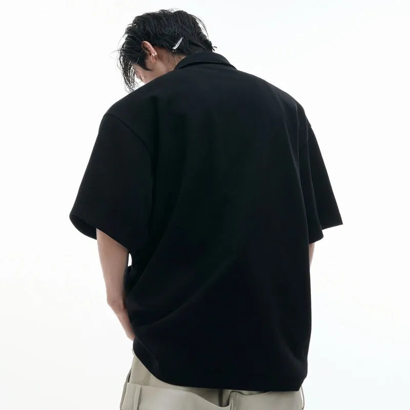 Men's loose fit short sleeve polo shirt with deconstructed multi-collar and geometric pattern in polyester.