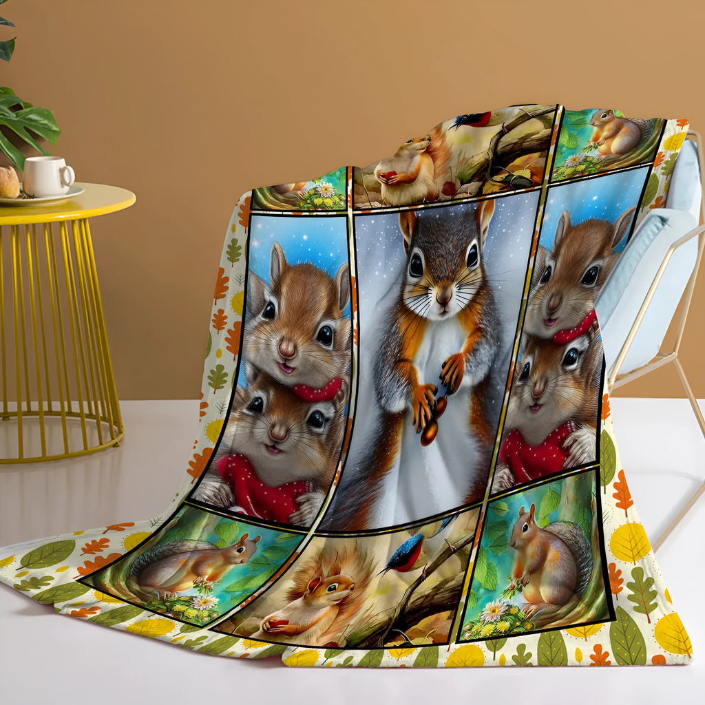 Yellow flannel blanket with white bellied squirrel print, 130x150cm, on a sofa