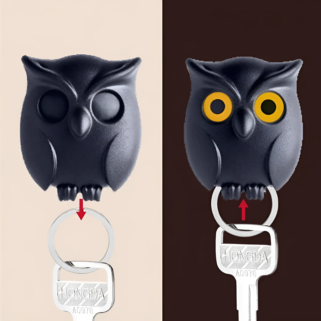 Magnetic wall key holder in white with attached keychains on a wall surface