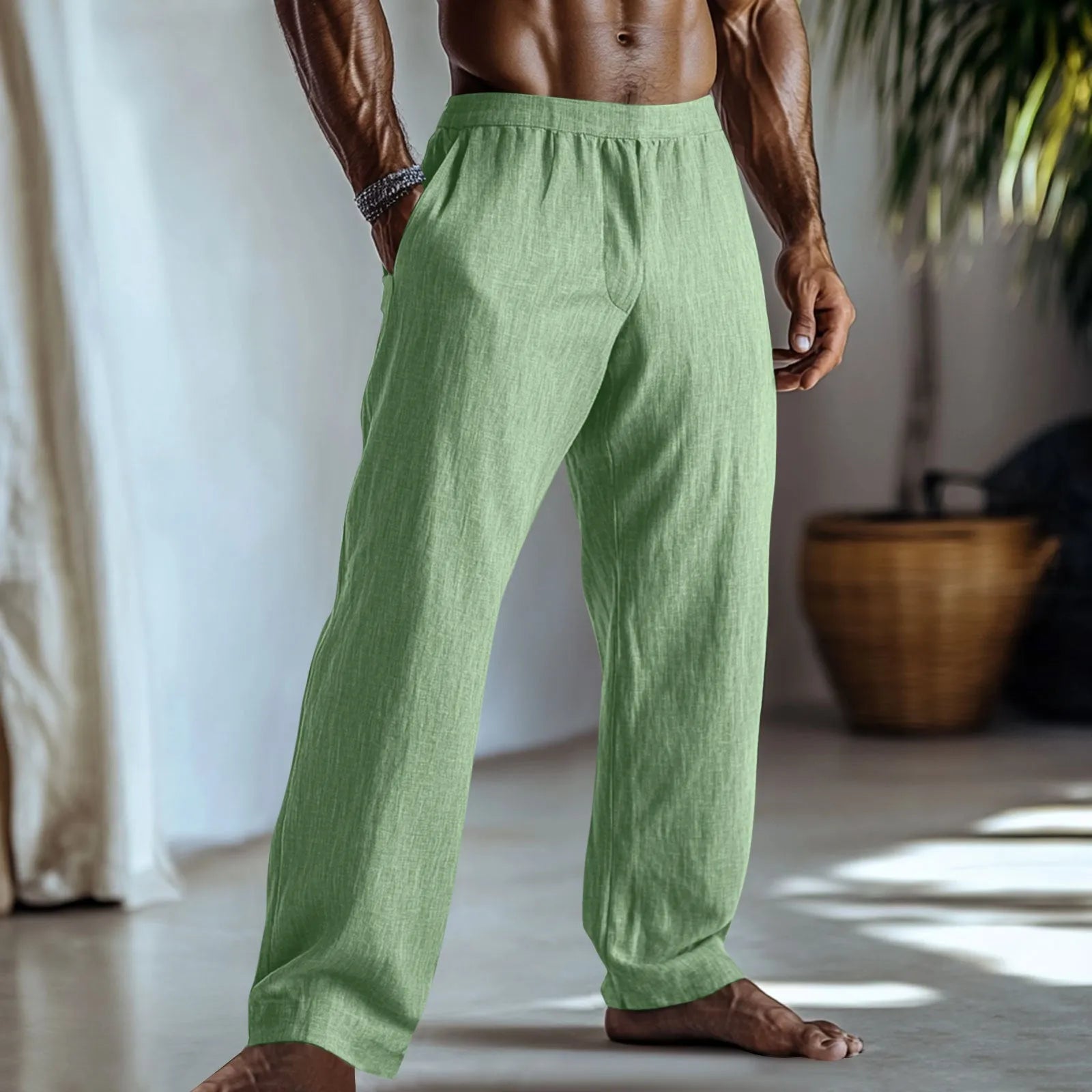 Straight-leg casual trousers in cotton and linen fabric, shown in light green colour with visible pockets.