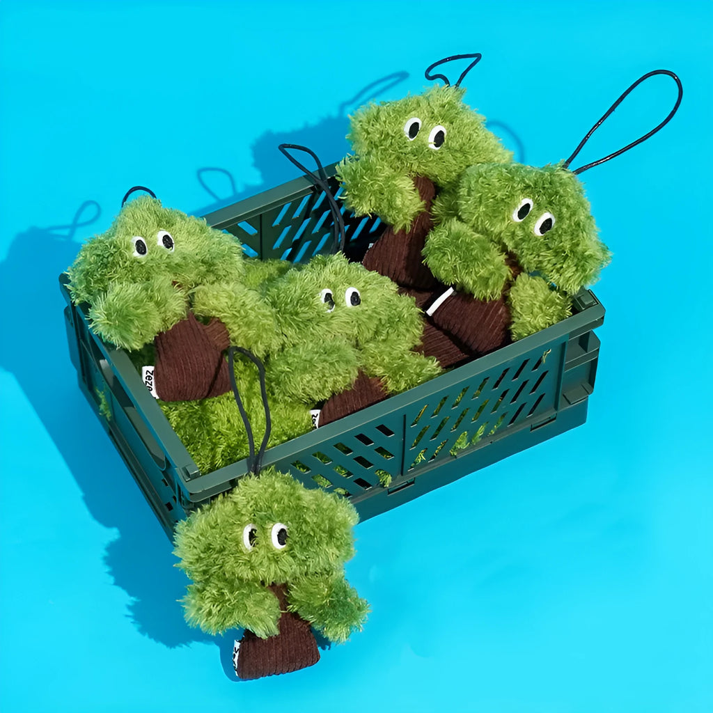 Green pine tree shaped fabric cat toy bag with hanging loop.