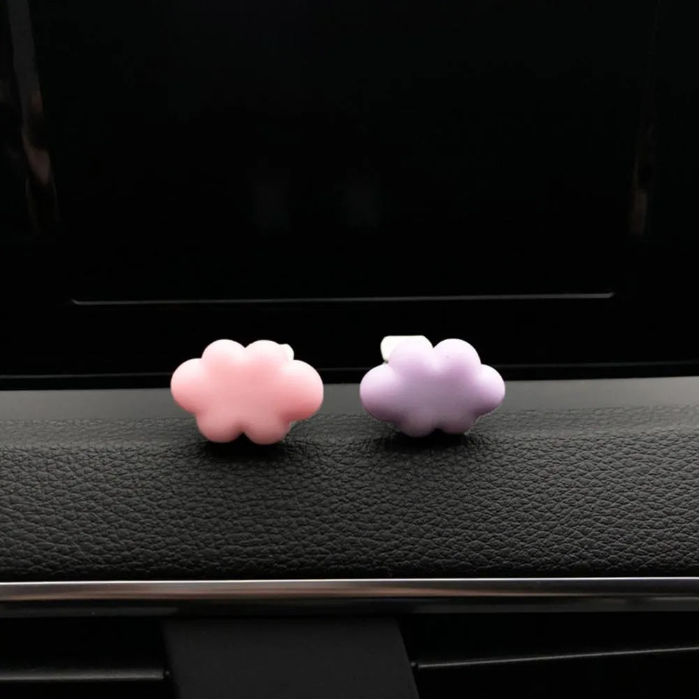 Resin cartoon Baiyun cloud car air freshener clip in light green, shown attached to a car air vent.