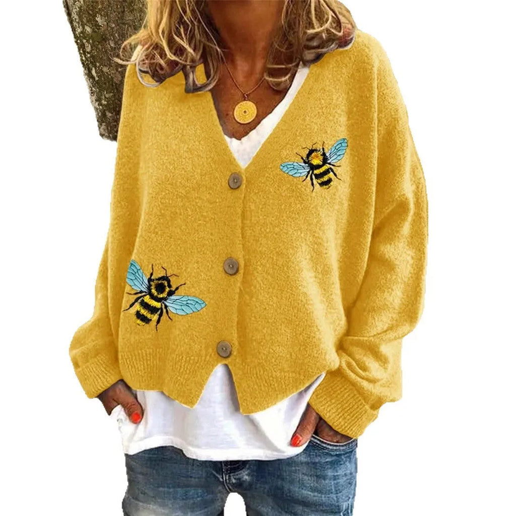 Loose fit animal pattern knitted cardigan sweater in black, made from polyester, with conventional sleeves.