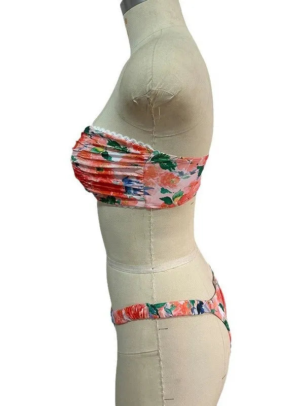 A colourful floral print lace tube top bikini set with matching shorts on a mannequin.