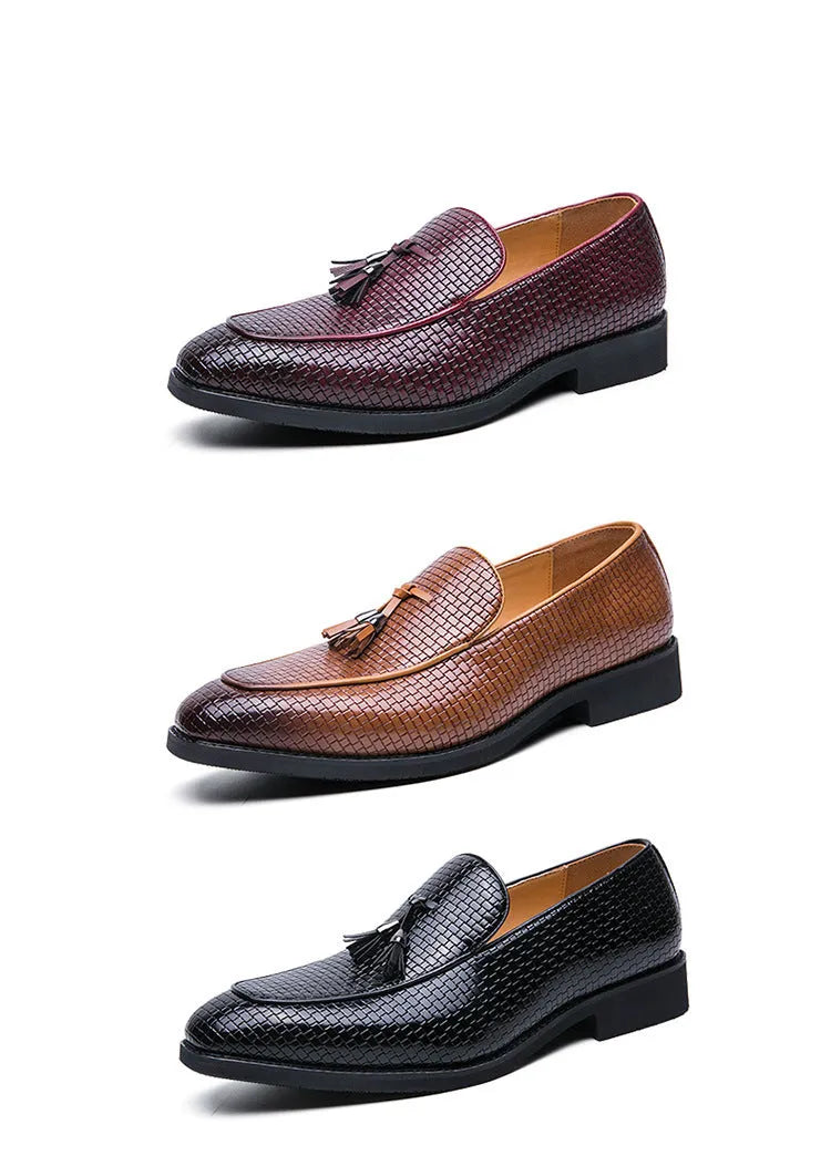 Men's black pointed slip-on leather shoes with a tassel detail on the low-top upper.