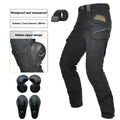 Men's green waterproof motorcycle trousers with belt and protective knee pads laid out flat.