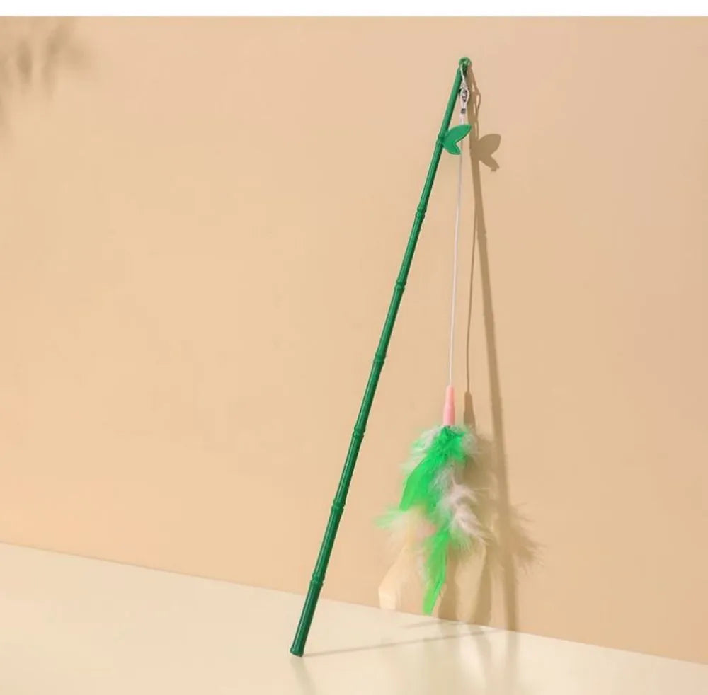 Green interactive cat feather wand toy with bells for play and training