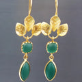Gold-coloured women's drop earrings with tassel detailing and water droplet elements on copper construction