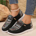 Women's black round toe flat shoes with a low-top PU upper and rubber sole on a plain background.