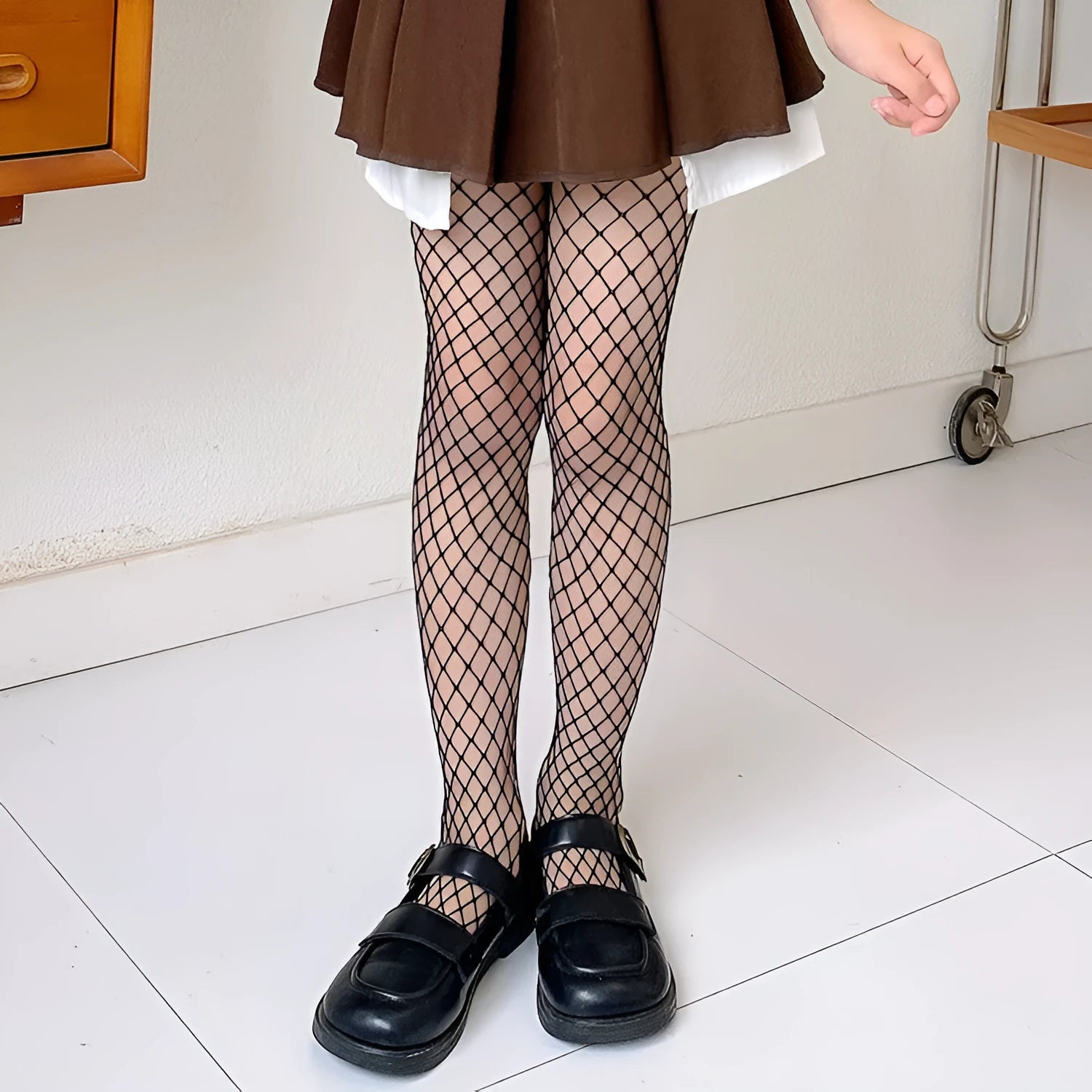 Women's mesh stockings in large, medium, and small hole patterns in black and white colours.