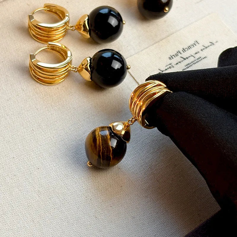 A pair of round geometric tigereye gemstone earrings with real gold plating in a French retro style.