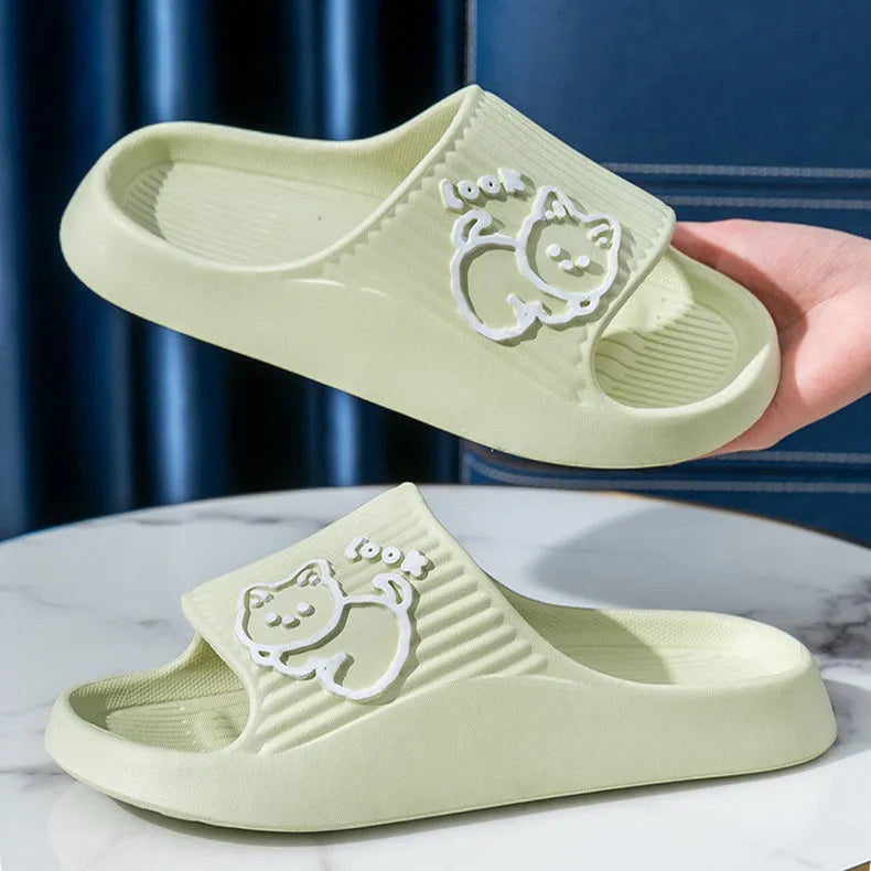 Women's green cat slippers with thick platform sole and flip-flop design.