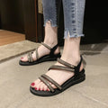 Women's silver Korean style flat sandals with elastic band and rhinestone decoration on a rubber sole.