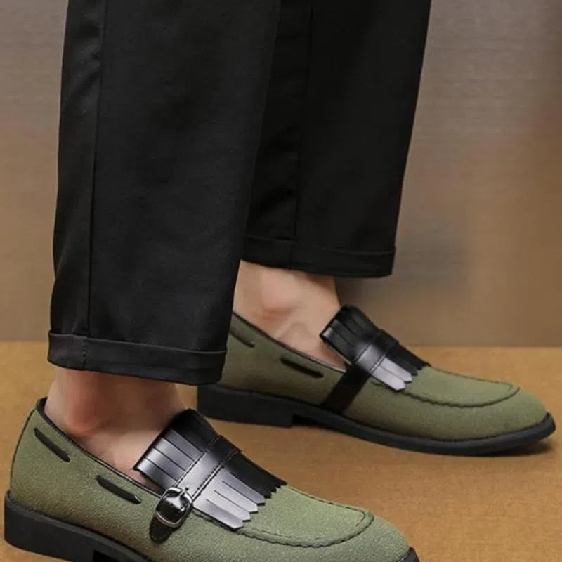 Men's gray denim loafer shoes with tassel accents, pointed toe, flat heel, on a white background