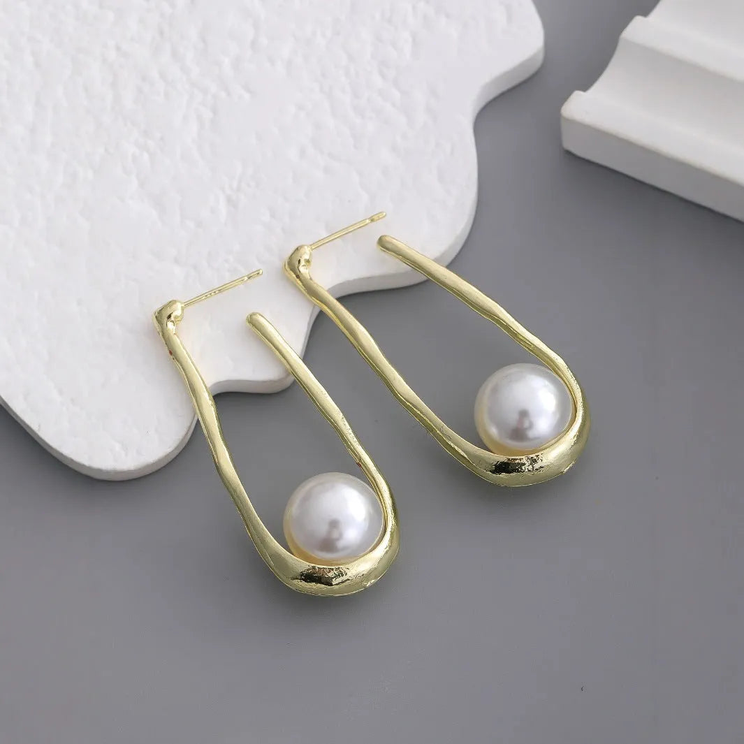 Vintage irregular pearl clip-on earrings in gold colour for women, fashion accessory