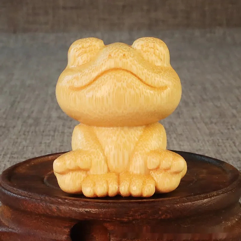 Solid bamboo smiling frog carving ornament with cartoon cute style measuring 5cm tall