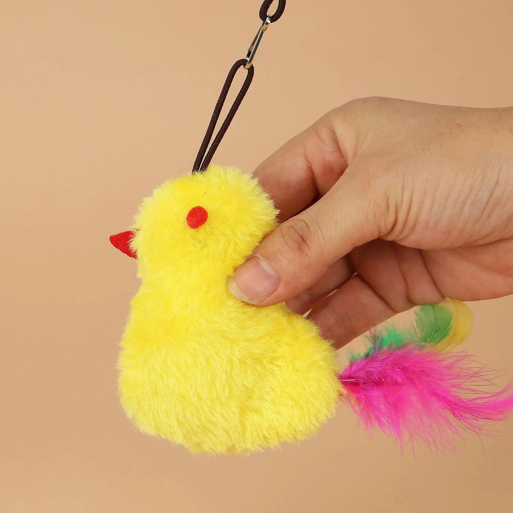 Grey and yellow interactive cat teaser toy with retractable rope, treat bulb, and dangling mouse, hanging from a door frame.