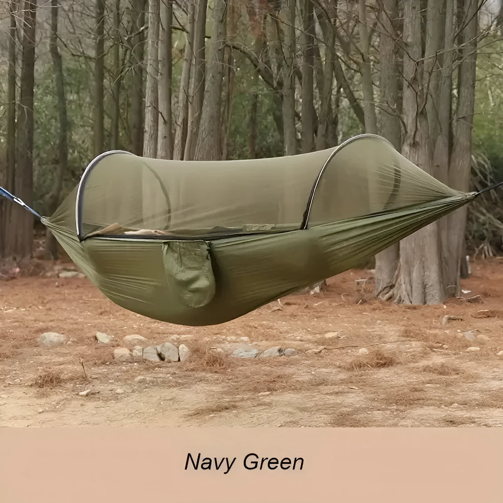 Outdoor camping automatic quick unfolding nylon hammock in camouflage colour with trees in background