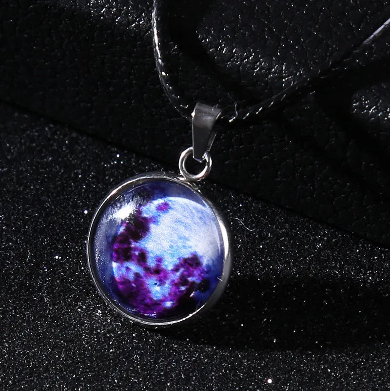 Luminous moon and constellation night sky pendant on an extendable alloy necklace chain.