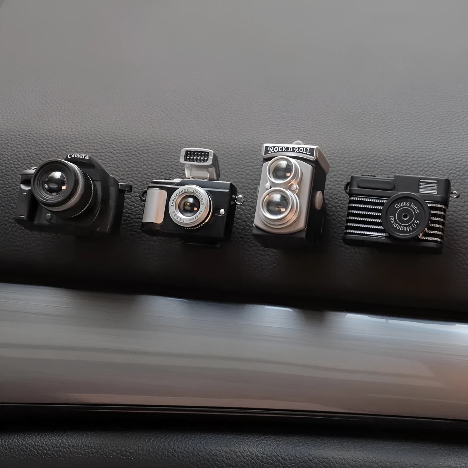 Set of four retro camera dot design plastic adhesive hooks for car interior, each measuring 4.2cm by 2.5cm.