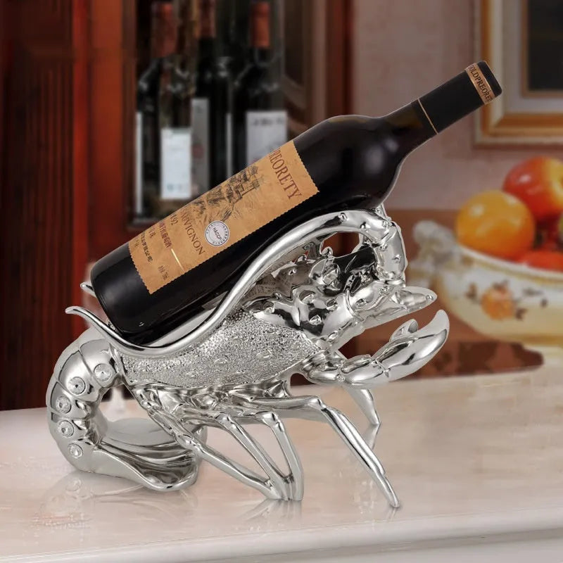 Lobster-shaped resin wine rack ornament in rose gold or silver, holding a wine bottle.