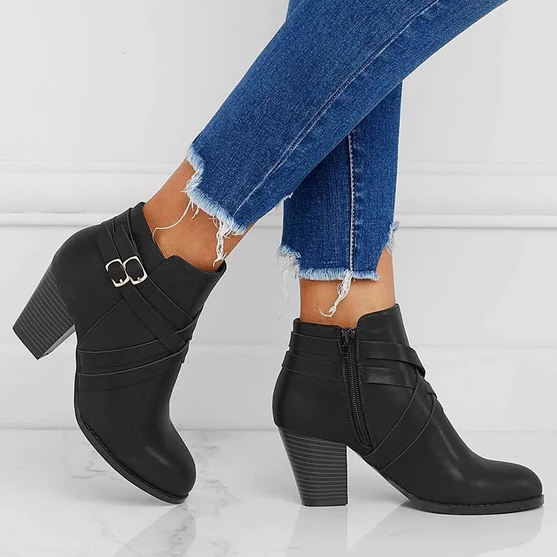 Women's black PU leather ankle boot with side zipper and 7cm heel on a rubber sole