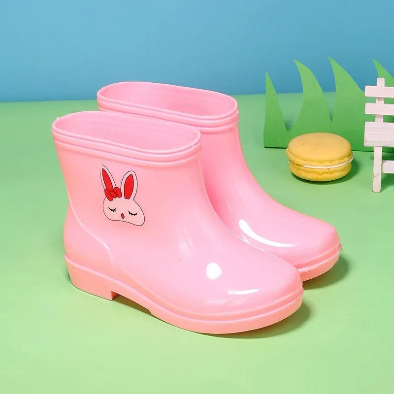 Children's non-slip plastic rain boots in solid colour with mid-calf height, available in multiple sizes