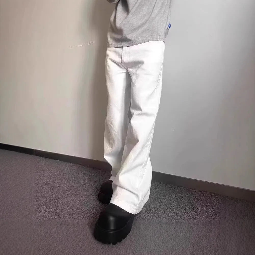 Men's white loose fit wide-leg straight denim jeans on a mid-waist model.