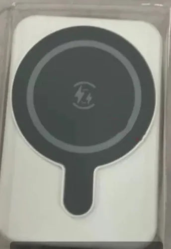 Mini magnetic wireless power bank 5000mAh with LED display and AI cooling in cool black colour on a table