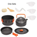 Orange travel picnic tableware folding camping cookware set with aluminium pots, pan, and utensils in mesh bag