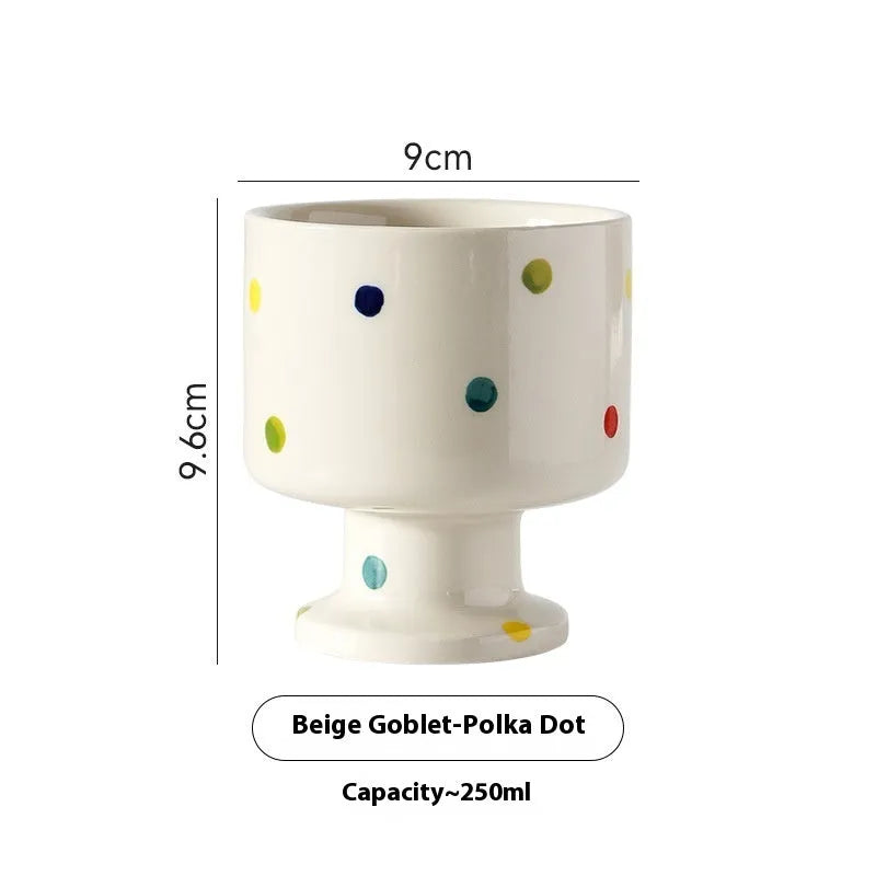 Hand-pinched irregular ceramic mug in a solid colour, shown from the side.