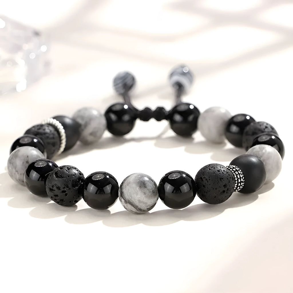 Black agate volcanic rock bracelet with diamond-cut facets, shown in two width sizes.