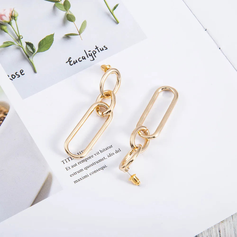 Sterling silver geometric hoop earrings with ring and line detailing