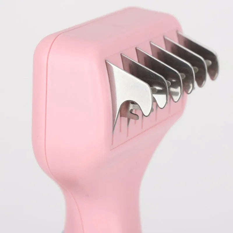 Stainless steel dog comb with knot knife edge and massage nodules, shown in pink colour option
