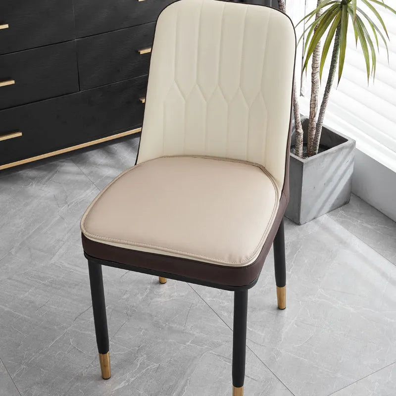 Leather horseshoe-shaped seat cushion shown in a solid colour on a chair